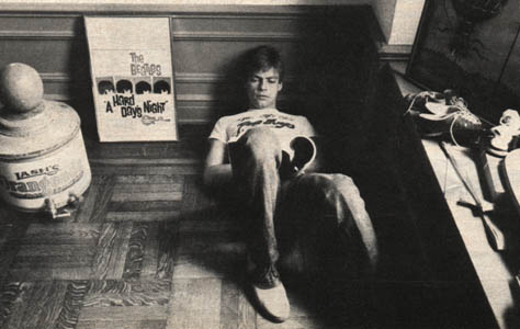 Mark reading in his NY apartment